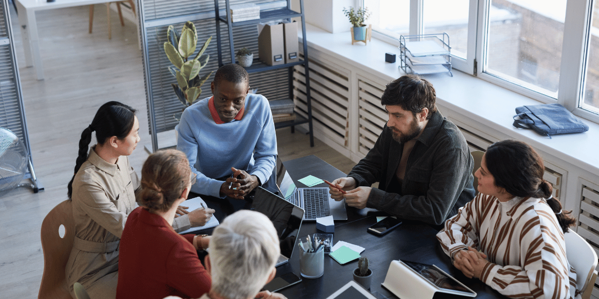 Team reviewing a change roadmap with milestones and ownership